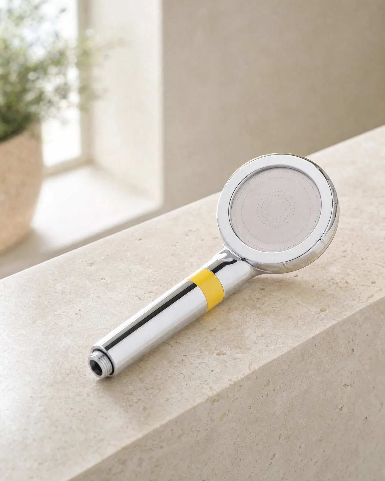 Marova filtered shower head on a light stone ledge